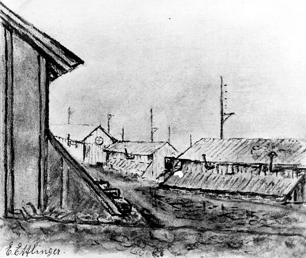 Baracken im Internierungslager Gurs am Nordrand der Pyrenäen; die Bettstatt bestand im Winter 1940/41 aus Strohschütte auf blankem Boden; hinten die Baracke des Schweizer Roten Kreuzes; Zeichnung von Emmy Ettlinger